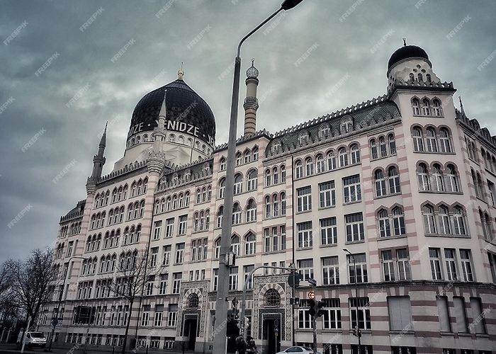 Yenidze Premium Photo | Low angle view of buildings against cloudy sky ... photo