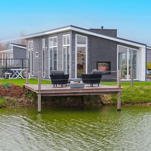 Modern Chalet On The Water At A Holiday Park Вемелдинге Exterior photo